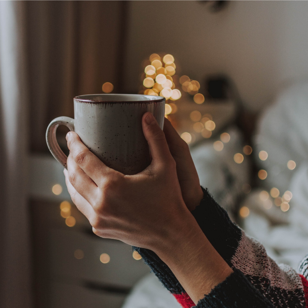 A person holding a cup.